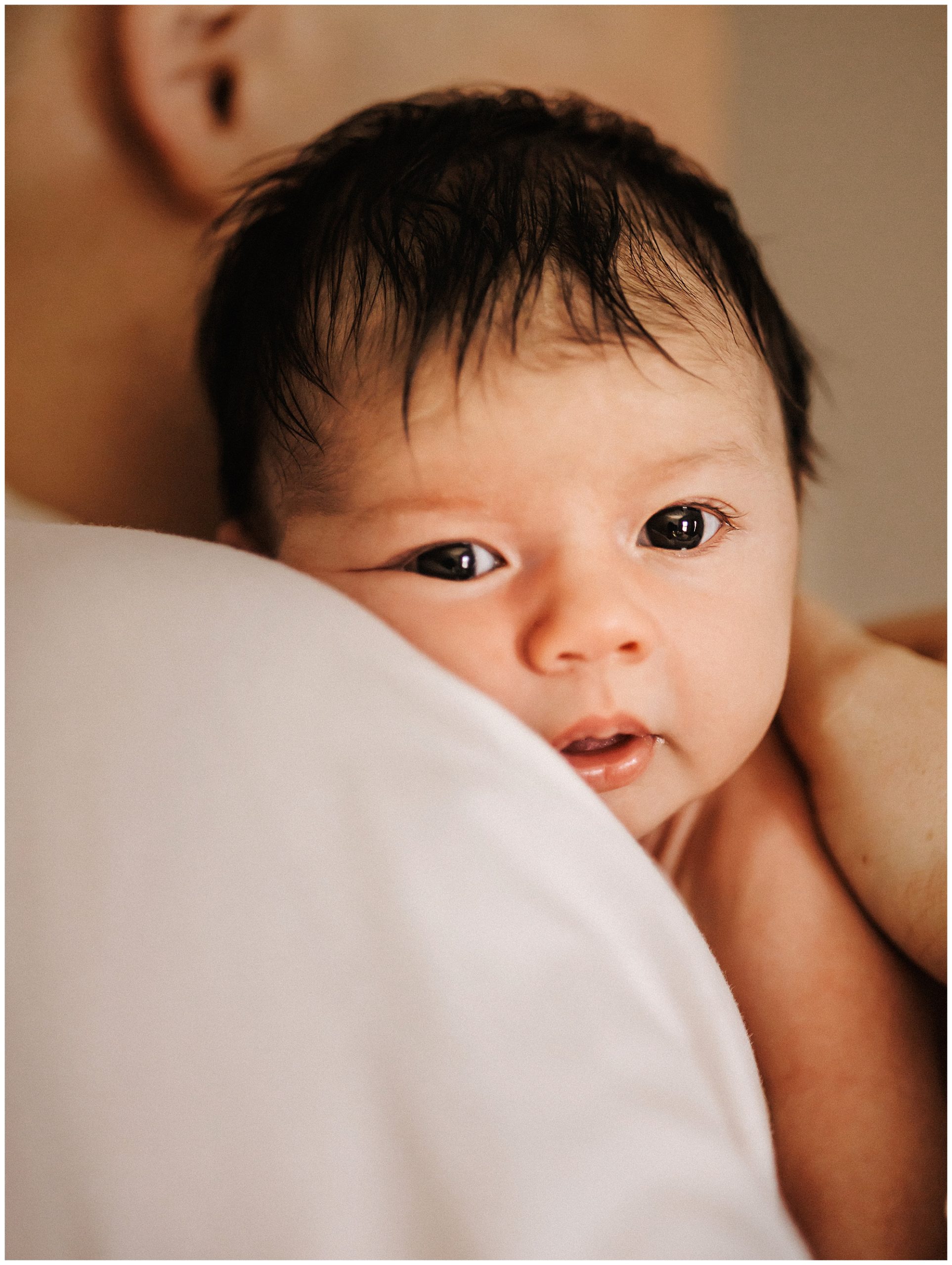 Close up Portrait of newborn baby boy during lifestyle newborn session