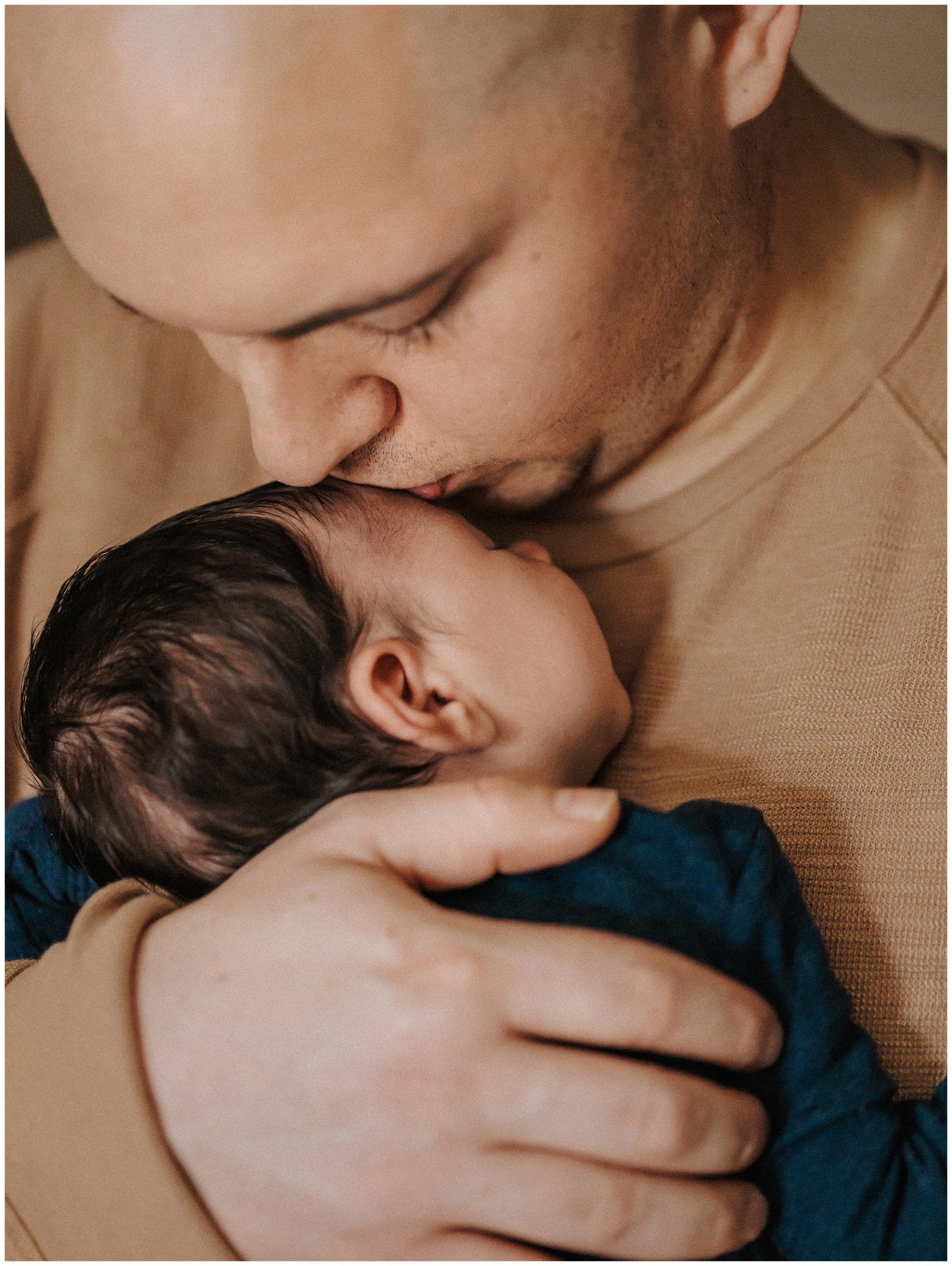 Father and newborn son during lifestyle newborn session in Murfreesboro
