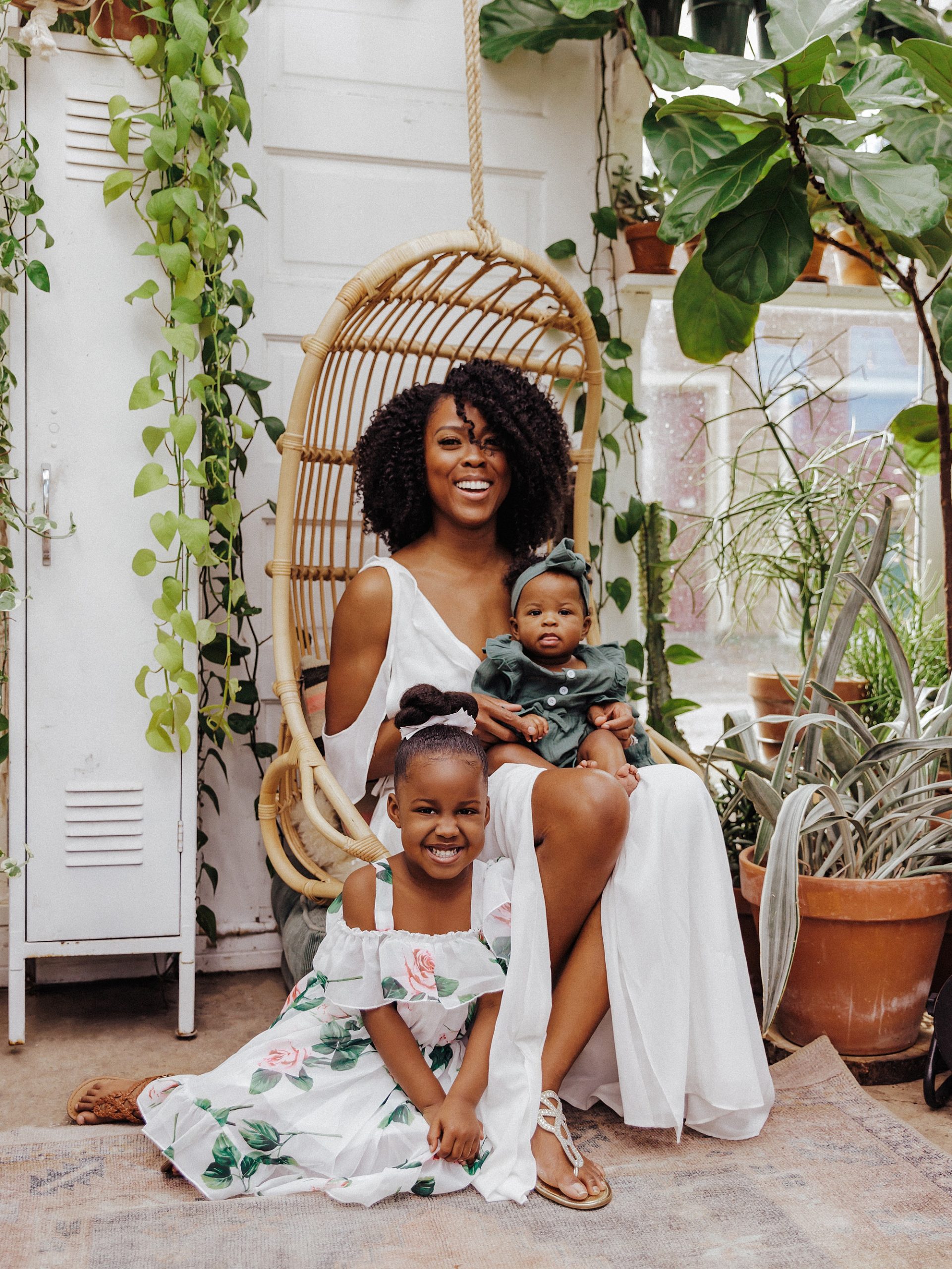 Portrait of Mother and daughters in a greenhouse in East Nashville