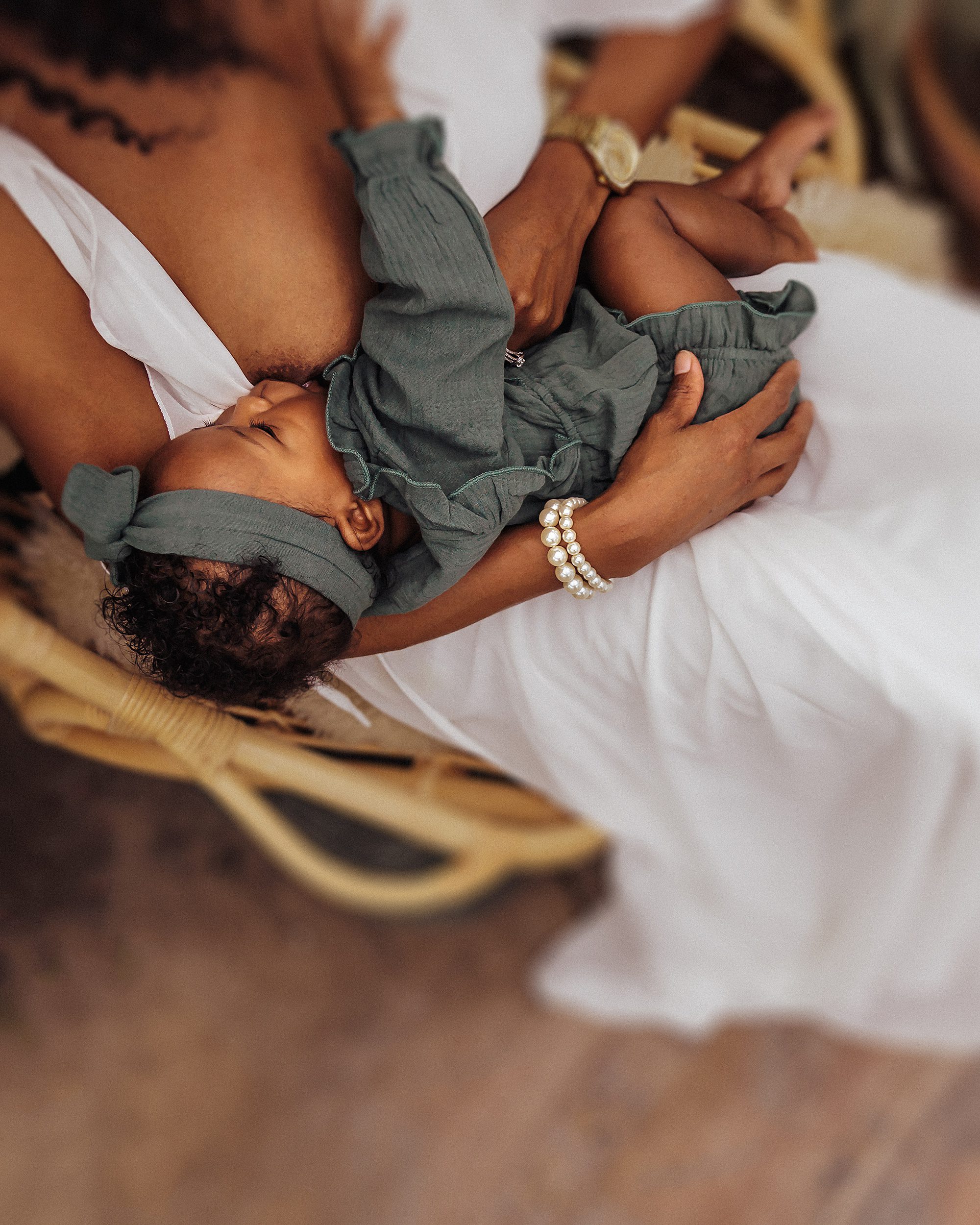 Breastfeeding Photography nashville - Portrait of mother nursing child during mini session in East Nash Greenhouse