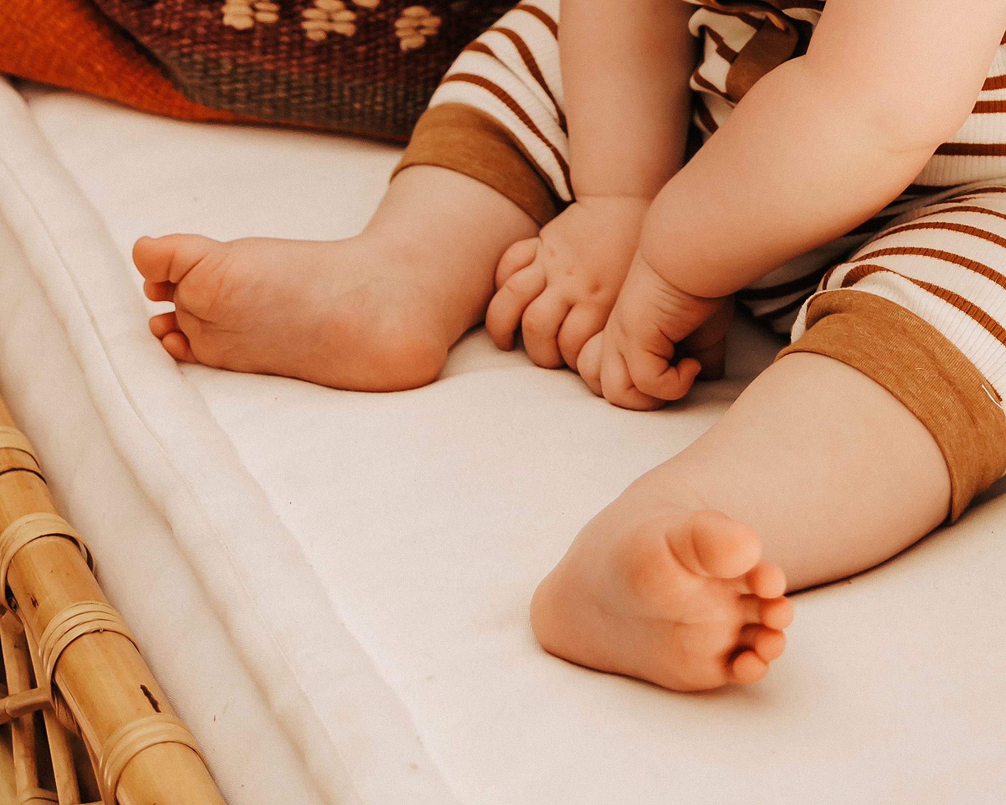 Infant boy’s feet during a portrait session