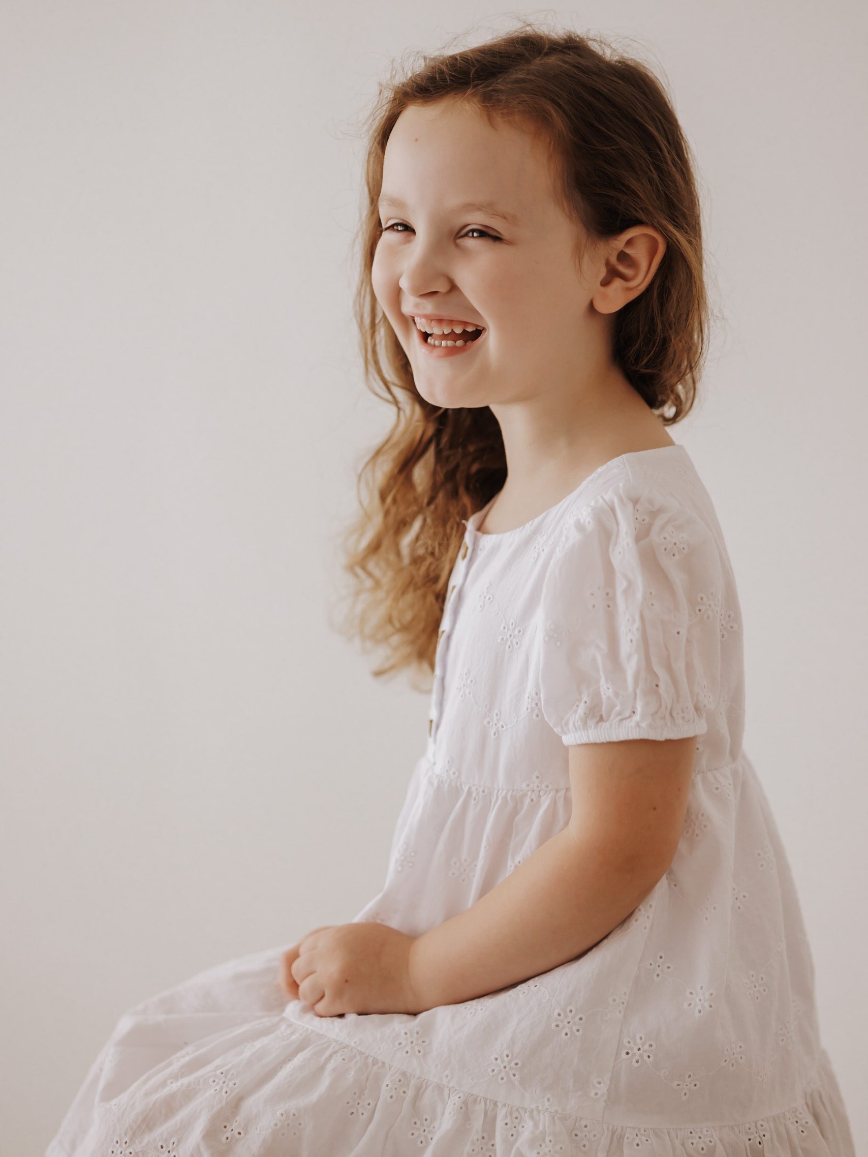 Little girl smiling during a studio back to school mini session in murfreesboro tn
