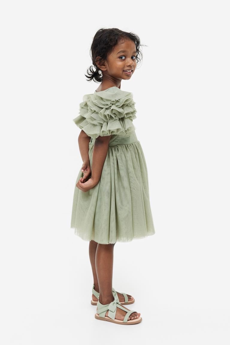 Product Photograph of Little girl wearing a sage green tulle dress