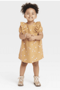 Product photograph of little girl wearing a mustard yellow toddler dress with pink flowers
