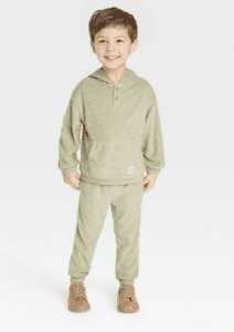 Product Photo of little boy wearing a sage green jogger set for spring