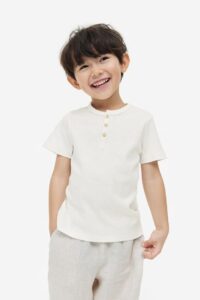 Product Photo of toddler boy wearing a cream henley