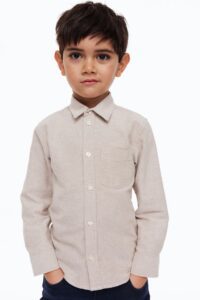 Product photo of little boy wearing a button up shirt