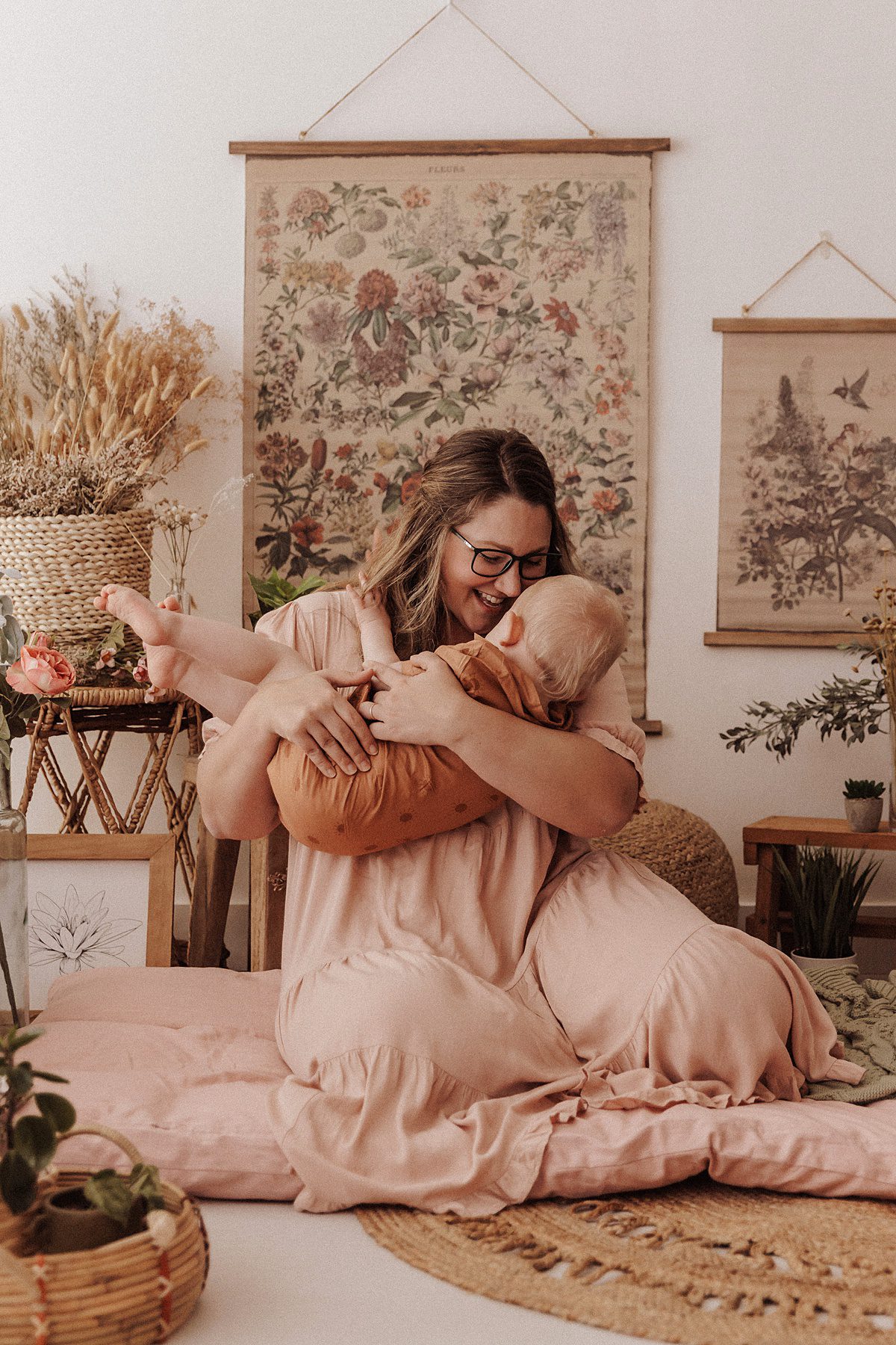 Mother holds her baby boy during a spring mini session