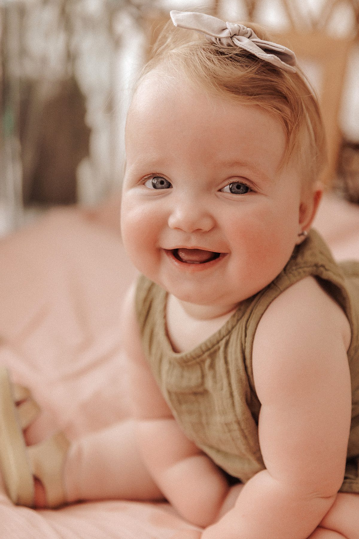 Blue eyed baby girl smiling