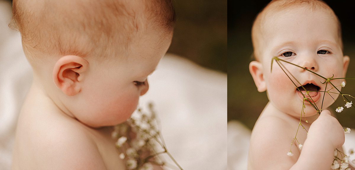 baby photography pose of a baby girl outside with flowers